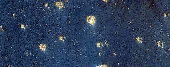 false-colors-assigned-to-certain-minerals-make-syria-planum-an-inky-blue-thats-speckled-with-gold